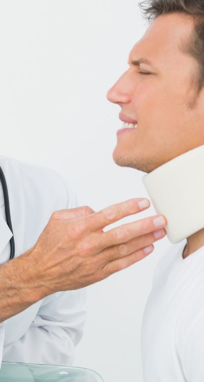 doctor looking at patients neck brace il